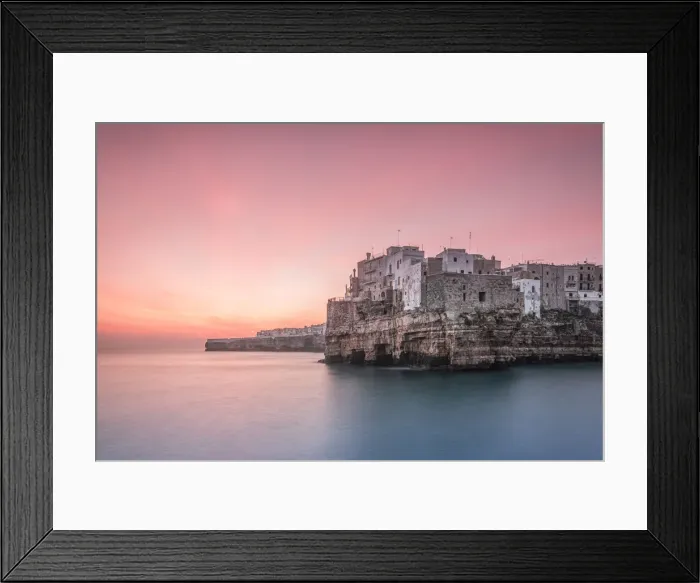 Framed Print : Old town of Polignano a Mare built on rocky cliffs at sunrise, Bari province, Apulia