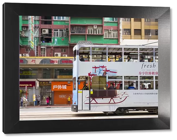 Double-Decker tram passing on Hennessy Road, Wan Chai, Hong Kong Island, Hong Kong, China