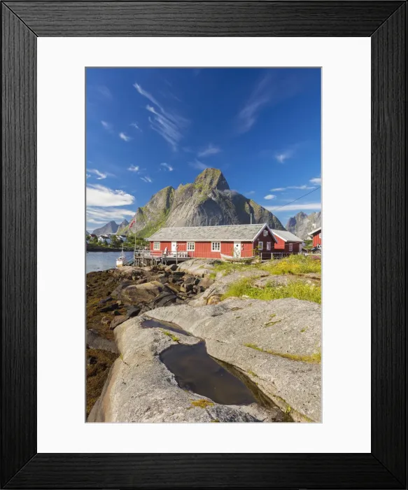 Framed Print : Typical houses of fishermen called Rorbu framed by rocky peaks and blue sea Reine Framed Print : Typical houses of fishermen called Rorbu framed by rocky peaks and blue sea Reine