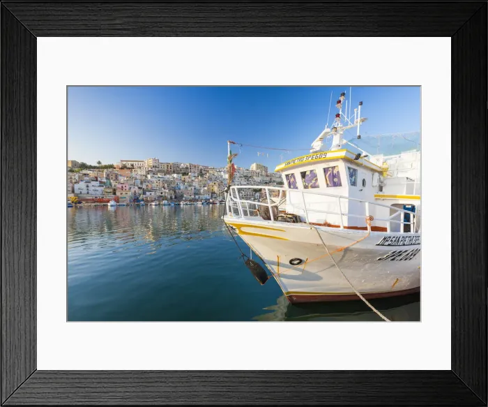 Framed Print : Fishing boats moored in the harbour surrounded by blue sea and the old town Sciacca Framed Print : Fishing boats moored in the harbour surrounded by blue sea and the old town Sciacca