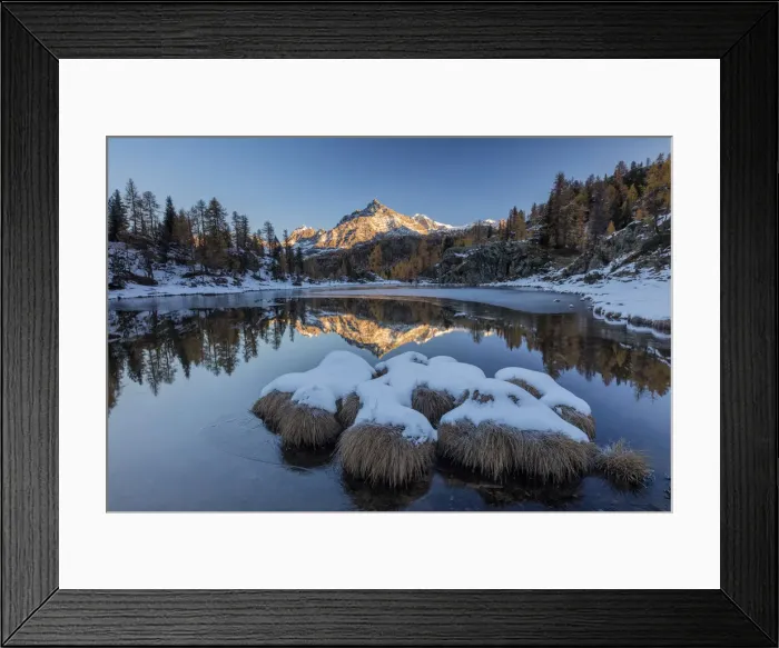 Framed Print : The rocky peak is reflected in the frozen Lake Mufule at dawn Malenco Valley province Framed Print : The rocky peak is reflected in the frozen Lake Mufule at dawn Malenco Valley province