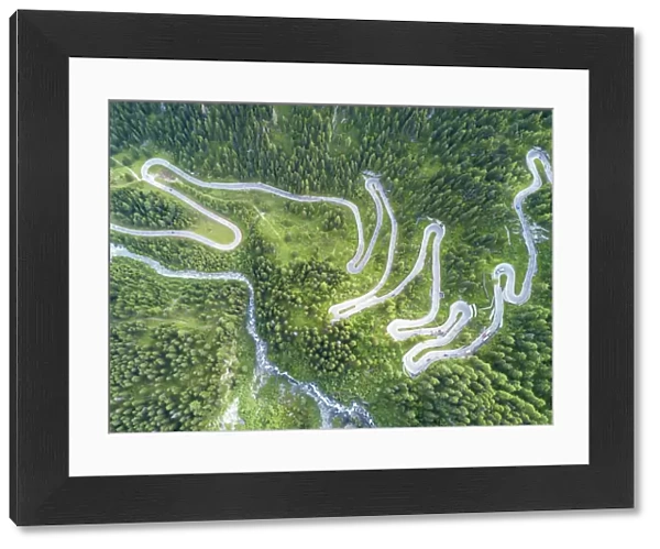 Aerial view of curves of the road between woods, Maloja Pass, Bregaglia Valley, canton