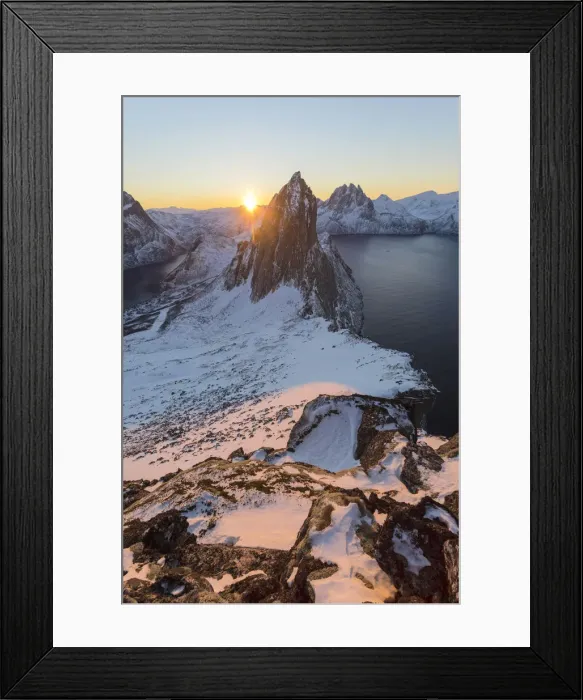 Framed Print : First lights of sunrise on Mount Segla and Mefjorden framed by the frozen sea seen Framed Print : First lights of sunrise on Mount Segla and Mefjorden framed by the frozen sea seen