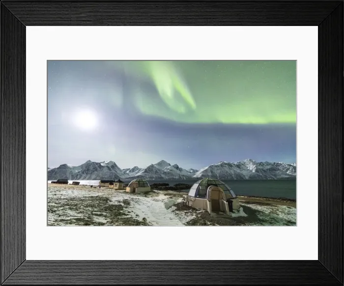 Framed Print : The Northern Lights and moon illuminate the glass igloos framed by icy sea Djupvik Lyngen Alps Tromso Norway Europe