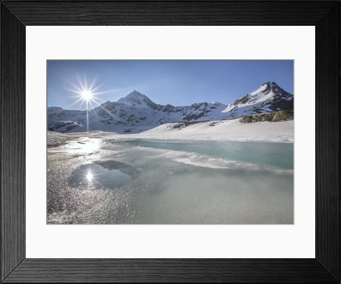 Framed Print : A double sun reflecting in a pool during the vernal thaw at the Lake Bianco - Gavia pass Framed Print : A double sun reflecting in a pool during the vernal thaw at the Lake Bianco - Gavia pass