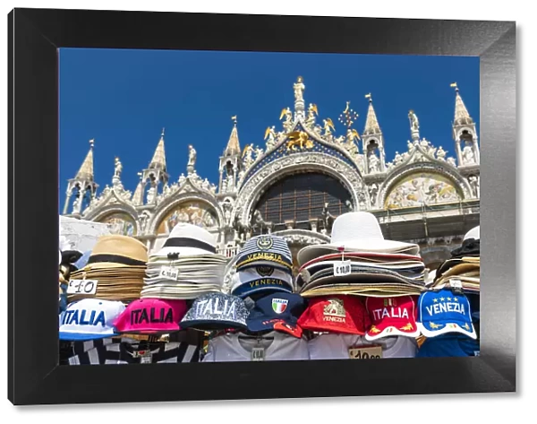 Venetian souvenirs with St Marks Basilica in the background. Venice, Veneto