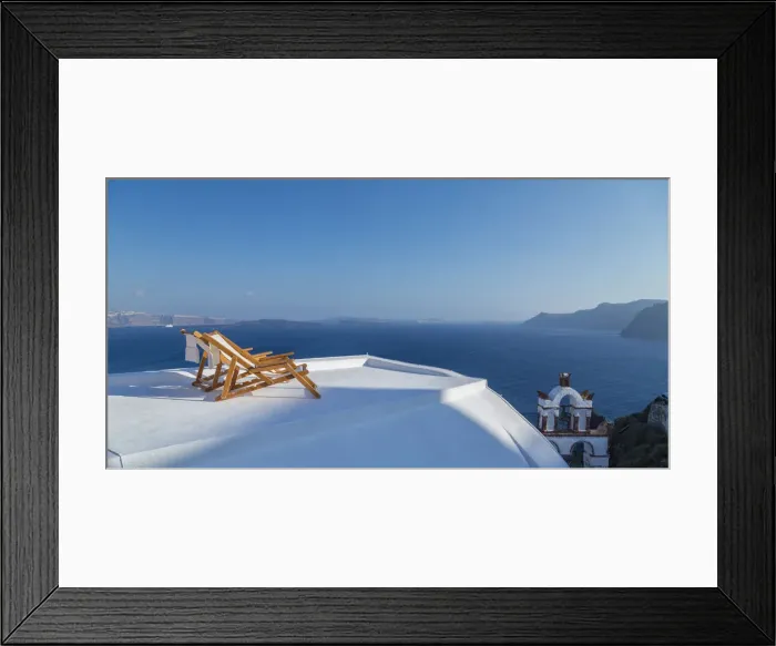 Framed Print : Private beach chairs on the coastline of Oia, Santorini, Cyclades Islands, Greece Framed Print : Private beach chairs on the coastline of Oia, Santorini, Cyclades Islands, Greece