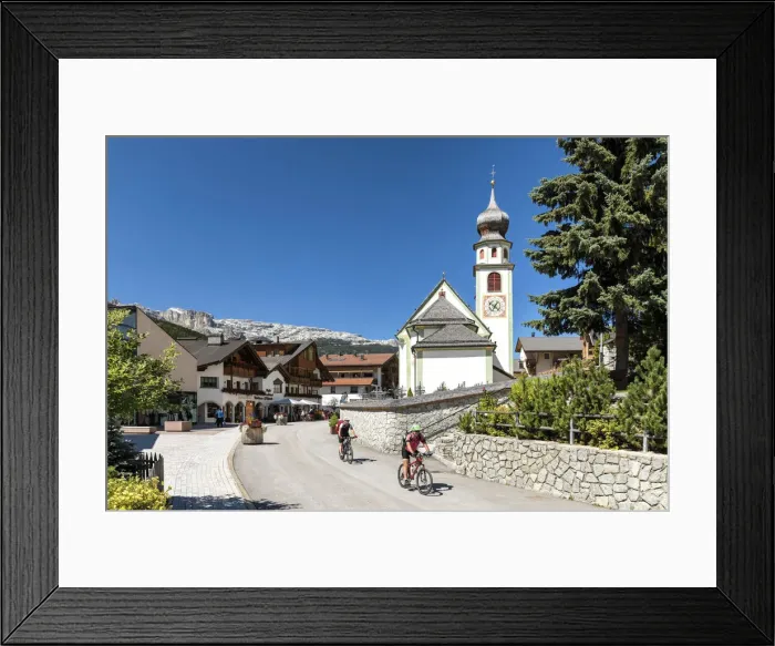 Framed Print : Cycling in San Cassiano village, Val Badia, Trentino Alto Adige, Italy, Europe
