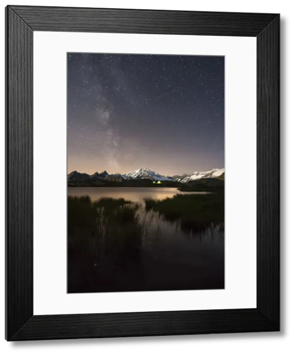 Framed Print : The Milky Way shines over the Fora Alp where some hikers have created their campsite Framed Print : The Milky Way shines over the Fora Alp where some hikers have created their campsite