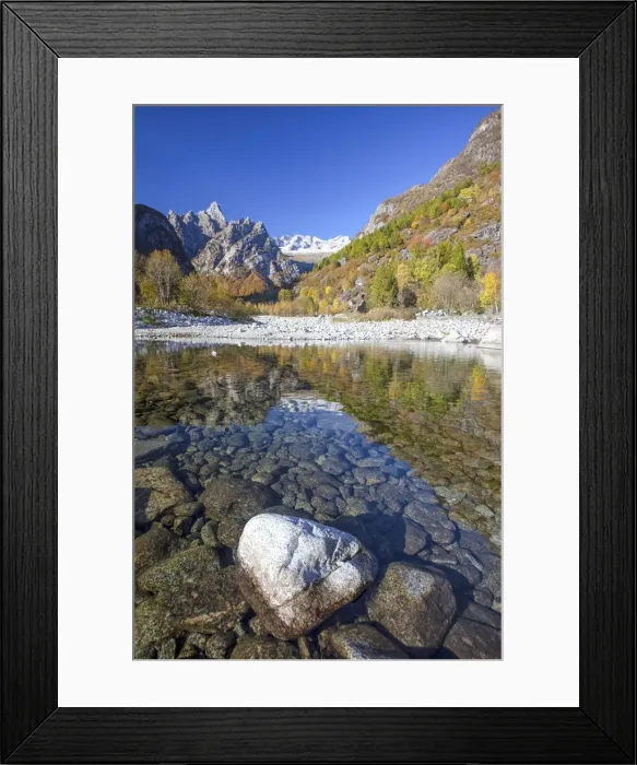 Framed Print : The autumn colors are reflected in Masino creek which creates a tranquil basin near Framed Print : The autumn colors are reflected in Masino creek which creates a tranquil basin near