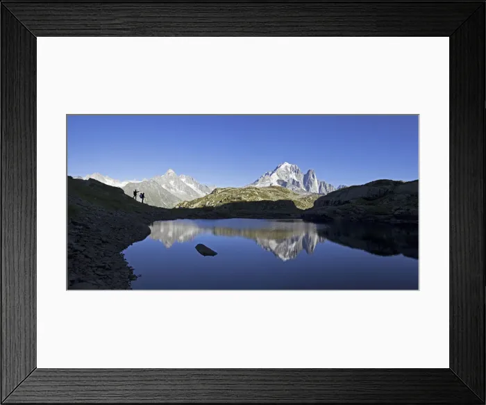 Framed Print : Hikers admire the view of Mont Blanc range from Lac de Chesery Framed Print : Hikers admire the view of Mont Blanc range from Lac de Chesery