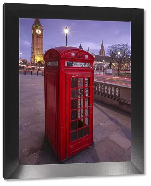 A typical red telephone box and Big Ben in the background. London England