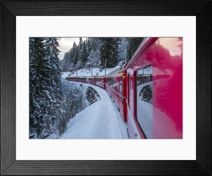 Framed Print : The windows of the red train reflecting the landscape of snowy woods of Sankt Moritz Framed Print : The windows of the red train reflecting the landscape of snowy woods of Sankt Moritz
