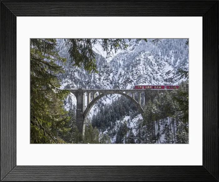Framed Print : The red train on the Wiesener Viadukt surrounded by snowy mountains Framed Print : The red train on the Wiesener Viadukt surrounded by snowy mountains