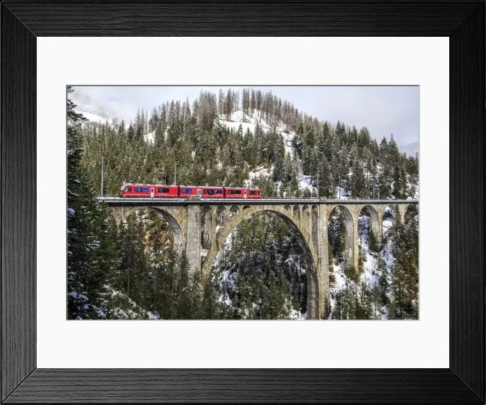 Framed Print : Wiesener Viaduct surrounded by snowy mountains and woods. Engadine. Canton of Graubunden Framed Print : Wiesener Viaduct surrounded by snowy mountains and woods. Engadine. Canton of Graubunden