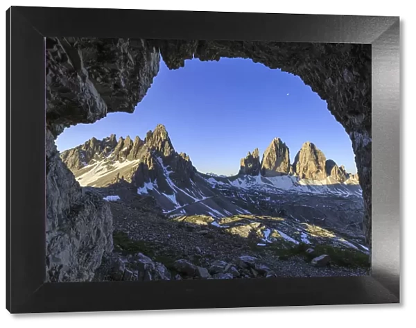 The Three Peaks of Lavaredo seen from a cave
