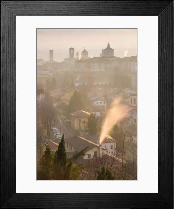 Framed Print : A cold morning in Bergamo upper town with some fog and smoke from the chimneys Framed Print : A cold morning in Bergamo upper town with some fog and smoke from the chimneys