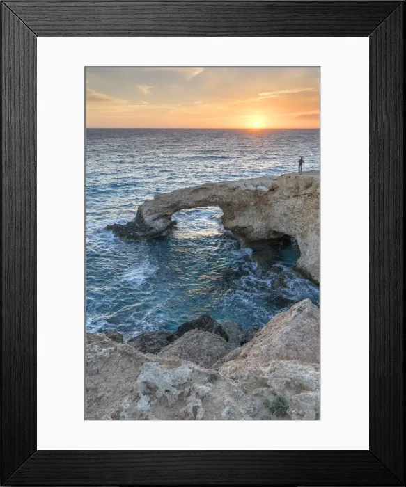 Framed Print : Cyprus, Ayia Napa, Cape Greco, man at sunset standing over the Love Bridge