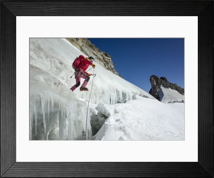 Framed Print : Mountaineer on ice jumps the final crevasse before reaching the Gran Paradiso peak Framed Print : Mountaineer on ice jumps the final crevasse before reaching the Gran Paradiso peak