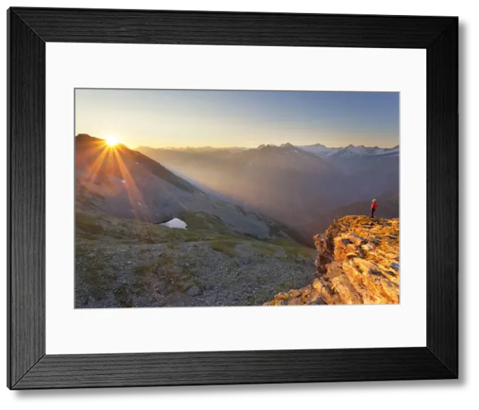 Framed Print : Hiker observes the sunrise from the summit of Peterskaopfl, Zillertal Alps, Tyrol Framed Print : Hiker observes the sunrise from the summit of Peterskaopfl, Zillertal Alps, Tyrol