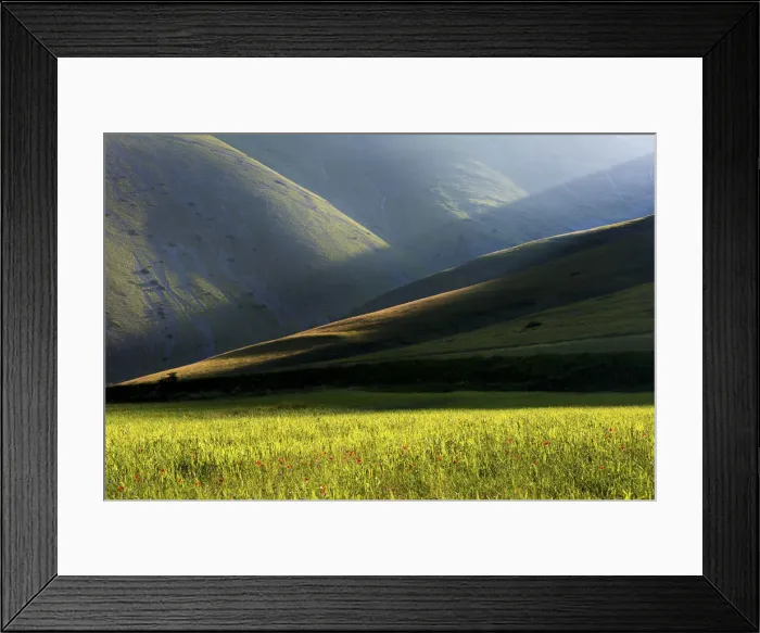 Framed Print : Sibillini national park, Umbria, Italy. Ray of light between mountain ridges, with fields Framed Print : Sibillini national park, Umbria, Italy. Ray of light between mountain ridges, with fields