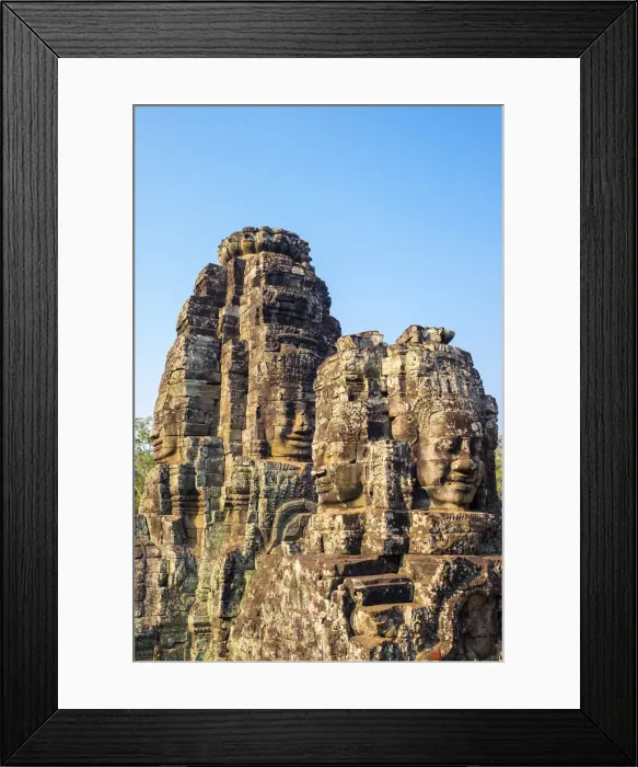 Framed Print : Carved stone faces at Prasat Bayon temple ruins, Angkor Thom, UNESCO World Heritage Site Framed Print : Carved stone faces at Prasat Bayon temple ruins, Angkor Thom, UNESCO World Heritage Site