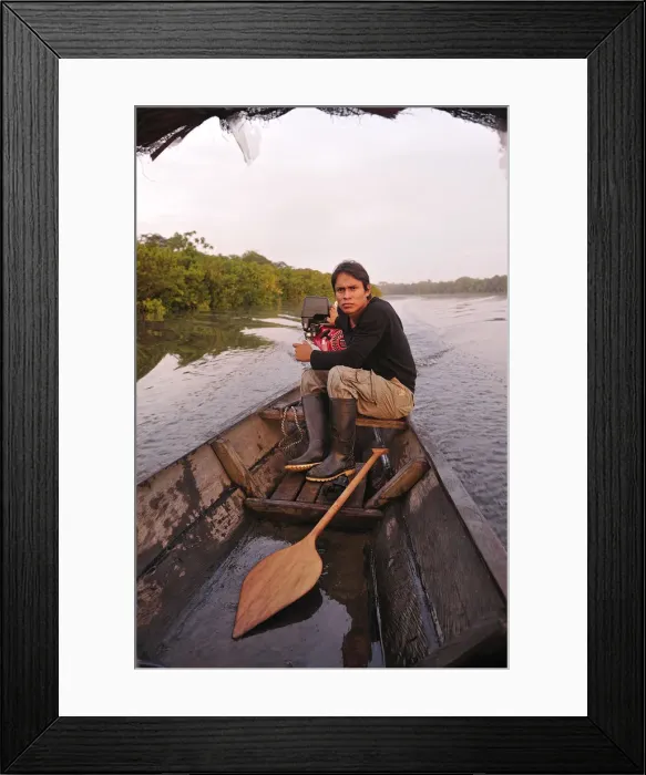Framed Print : Man in dugout canoe on the Lago de Tarapoto, Amazon River, near Puerto Narino, Colombia