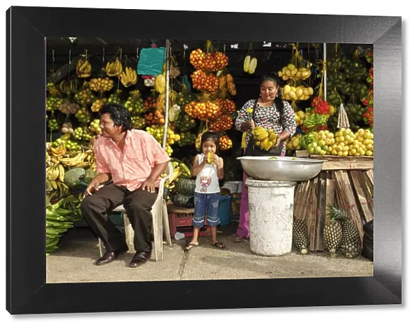 South America, Colombia, Leticia, Amazon region, Family selling fruit at a market