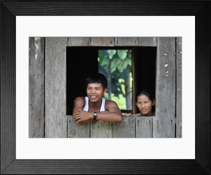 Framed Print : Couple looking out of window in the Amacayon Indian Village, Amazon river, Puerto Narino Framed Print : Couple looking out of window in the Amacayon Indian Village, Amazon river, Puerto Narino