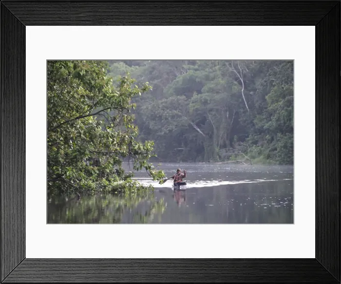 Framed Print : Man in a dugout canoe on the Amazon River, near Puerto Narino, Colombia Framed Print : Man in a dugout canoe on the Amazon River, near Puerto Narino, Colombia
