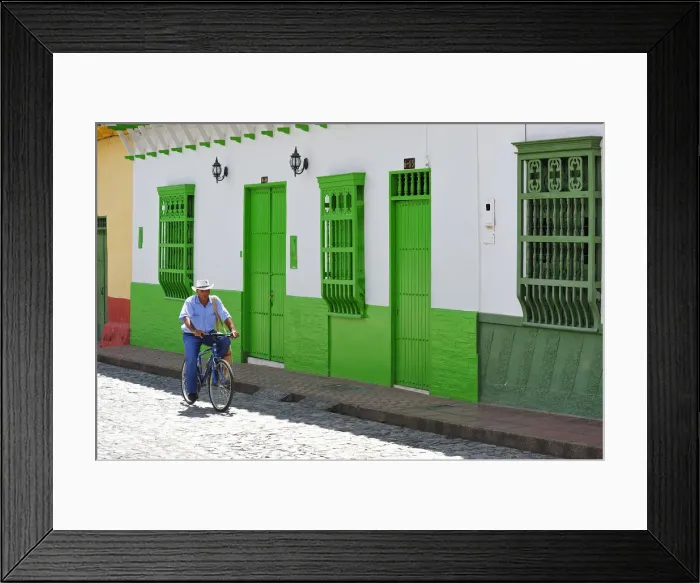Framed Print : Man on bike in streets of Santa Fe de Antioquia, Colombia, South America Framed Print : Man on bike in streets of Santa Fe de Antioquia, Colombia, South America