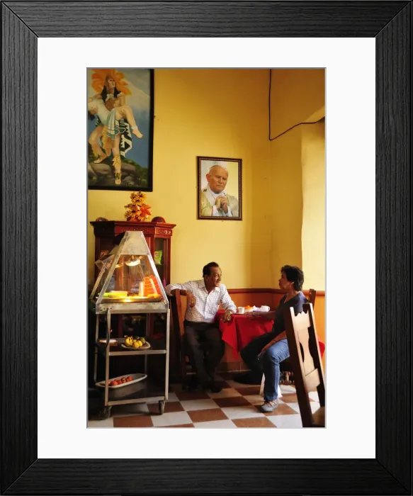 Framed Print : Two men talking in a cafe in Santa Fe de Antioquia, Colombia, South America Framed Print : Two men talking in a cafe in Santa Fe de Antioquia, Colombia, South America
