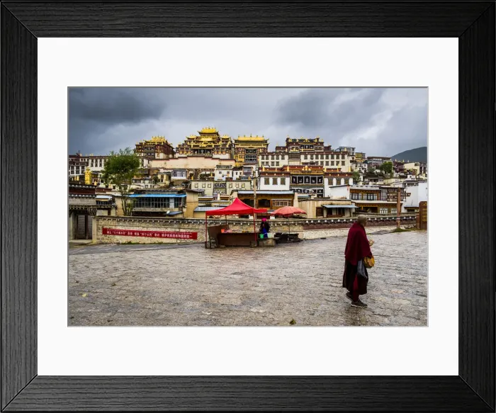 Framed Print : Monk walking in front at the Ganden Sumtseling Monastery, Zhongdian, Shangri-La County Framed Print : Monk walking in front at the Ganden Sumtseling Monastery, Zhongdian, Shangri-La County