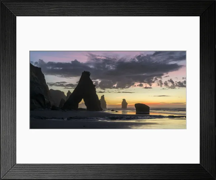 Framed Print : Sunset at the Three Sisters beach, with Mt Taranaki seen through the rock cave