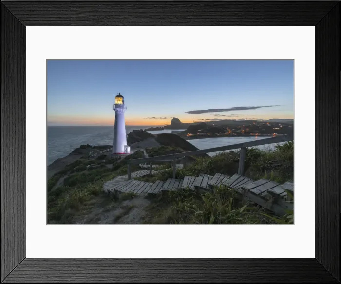 Framed Print : Castlepoint lighthouse lit in purple at dusk. Castlepoint, Wairarapa region, North Island
