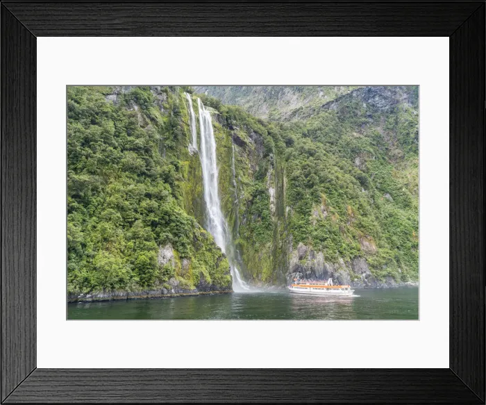 Framed Print : Touristic boat facing Stirling Falls in Milford Sound. Fiordland NP, Southland district Framed Print : Touristic boat facing Stirling Falls in Milford Sound. Fiordland NP, Southland district