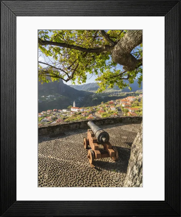Framed Print : Historical cannon at Faial fortress with the village in the background Framed Print : Historical cannon at Faial fortress with the village in the background