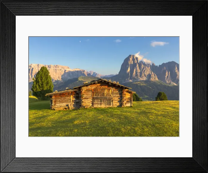 Framed Print : Last rays of sun on traditional hut with view on Sassolungo and Sella Group