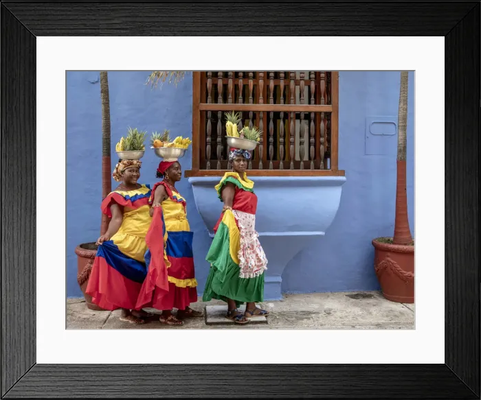 Framed Print : Colourful Palenqueras selling fruits on the street of Cartagena, Bolivar Department Framed Print : Colourful Palenqueras selling fruits on the street of Cartagena, Bolivar Department