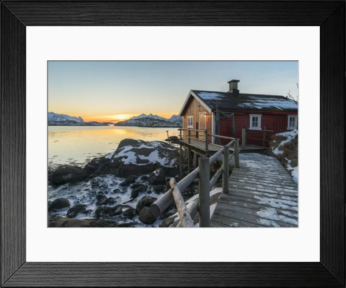 Framed Print : Typical fishermen red house on the sea at dawn in winter. Svolvaer, Nordland county Framed Print : Typical fishermen red house on the sea at dawn in winter. Svolvaer, Nordland county