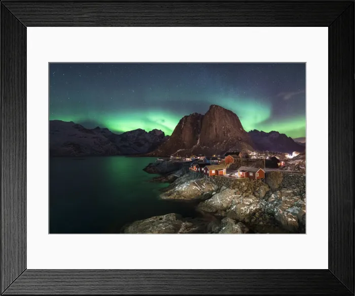 Framed Print : Northern lights in the sky over the village. Hamnoy, Nordland county, Northern Norway