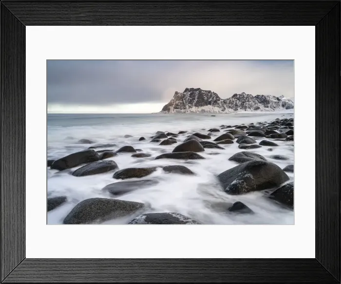 Framed Print : Uttakleiv Beach, with rocks in the fore and mountains in the background
