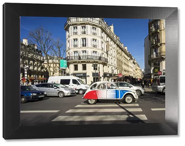 A vintage Citroen car painted in the colours of the France flag gets stuck in the