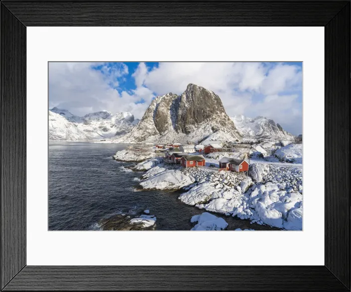 Framed Print : Hamnoy village covered in snow, with Festheltinden peak in the background Framed Print : Hamnoy village covered in snow, with Festheltinden peak in the background