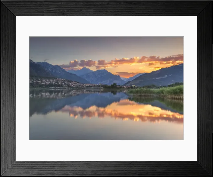 Framed Print : Red clouds and Lecco mountains reflected on lake Annone, Lecco province, Brianza