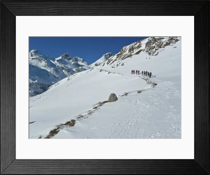 Framed Print : row of snowshoeing is directed towards the summit Cufercalhutte, Switzerland Framed Print : row of snowshoeing is directed towards the summit Cufercalhutte, Switzerland