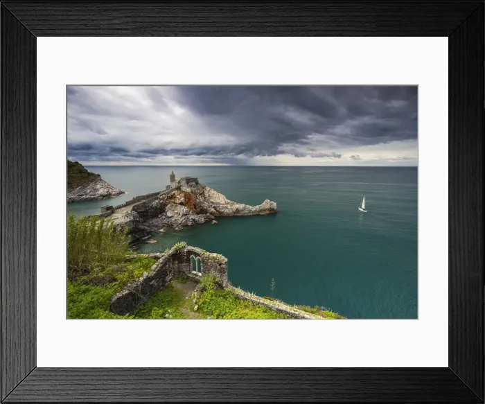 Framed Print : Stormy clouds over Portovenere and church of San Pietro, La Spezia, Liguria, Italy
