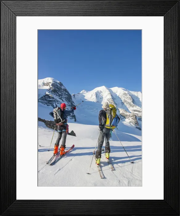 Framed Print : Ski mountaneers in the Bernina glacier looking for piz Palu. Engadina valley, Switzerland Framed Print : Ski mountaneers in the Bernina glacier looking for piz Palu. Engadina valley, Switzerland