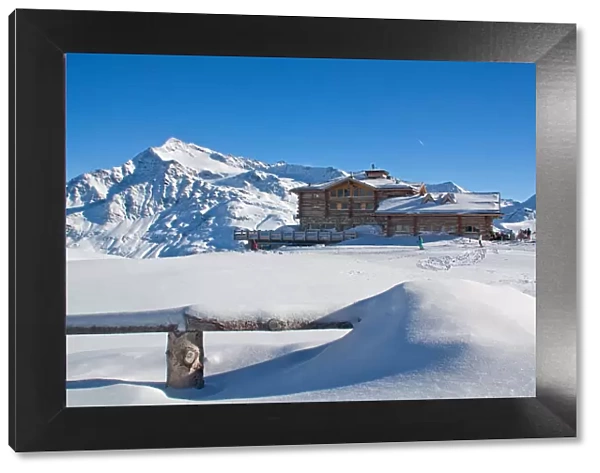 Pristine snow at Sunny Valley mountain hut. Valtellina, Lombardy, Italy