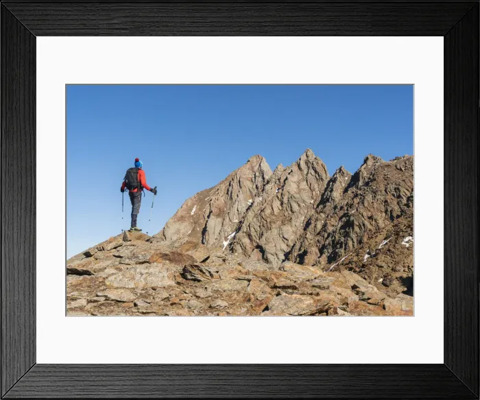 Framed Print : Hiker between the rocks of Monticello peak in val Cane, Stelvio National Park. Temu, Val Camonica, Brescia, Lombardy, Italy Framed Print : Hiker between the rocks of Monticello peak in val Cane, Stelvio National Park. Temu, Val Camonica, Brescia, Lombardy, Italy